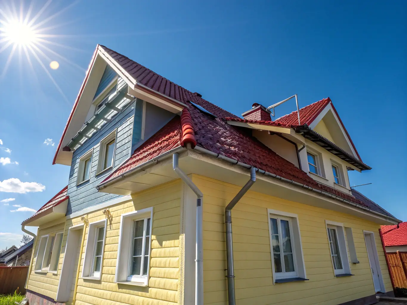 A residential house with clean siding after power washing, showcasing the effectiveness of the service.